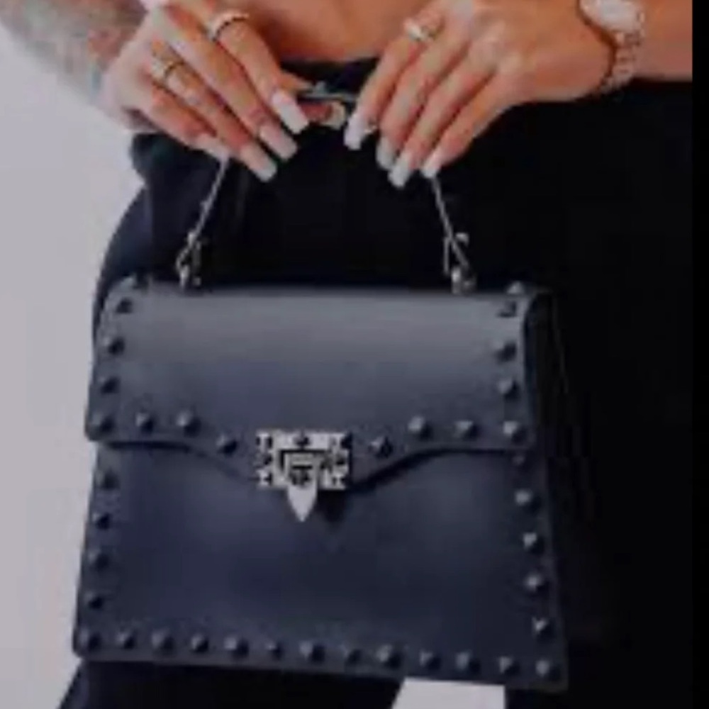 Black studded clutch